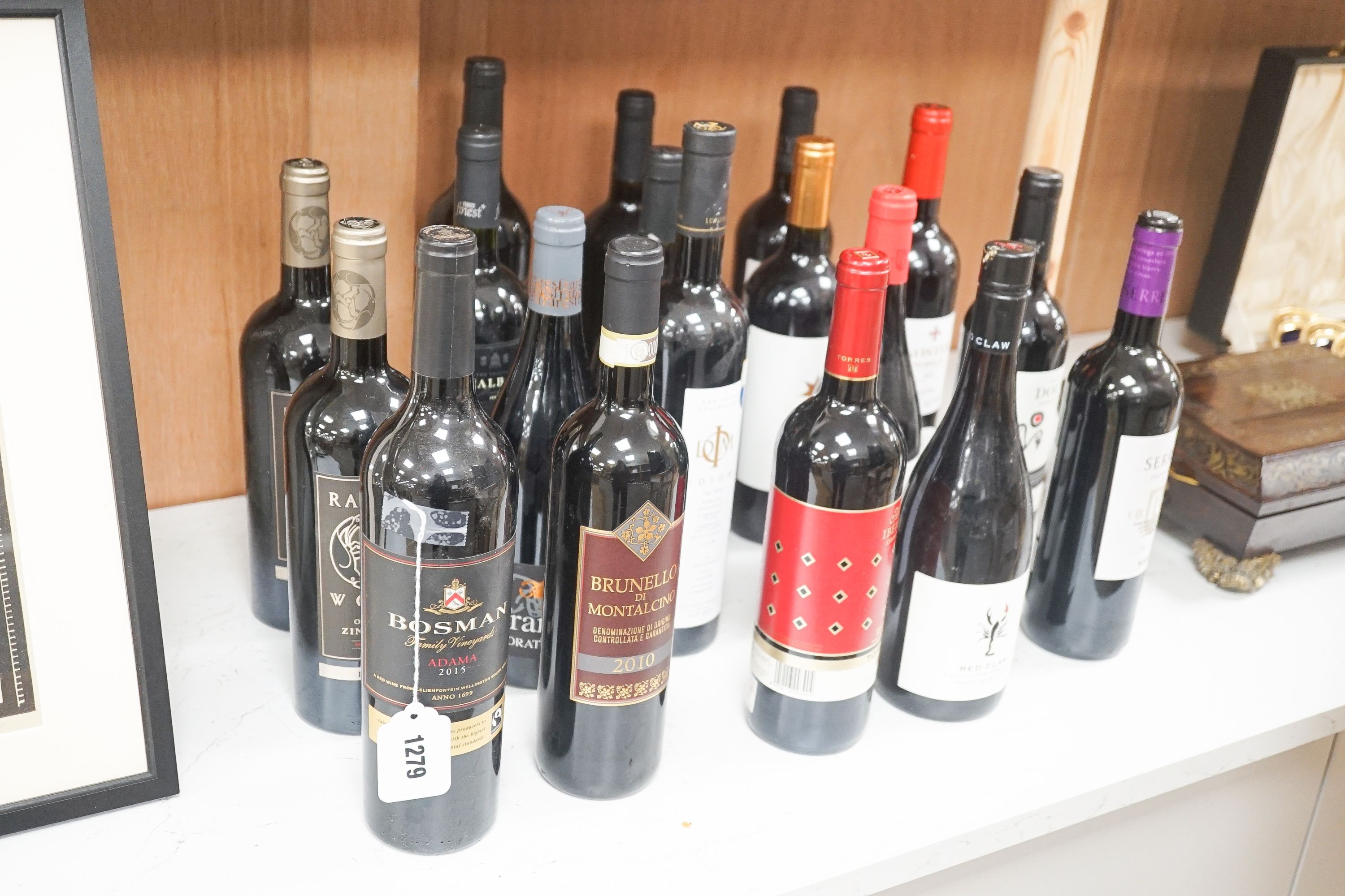 Eighteen assorted bottles of European, North & South American, South African and Australian red wines including Estacion 1883 2012 Pinot Noir, Bosman Adama 2015, Idiom Cape Blend 2008 and Ravens Wood Old Vine Zinfandel,